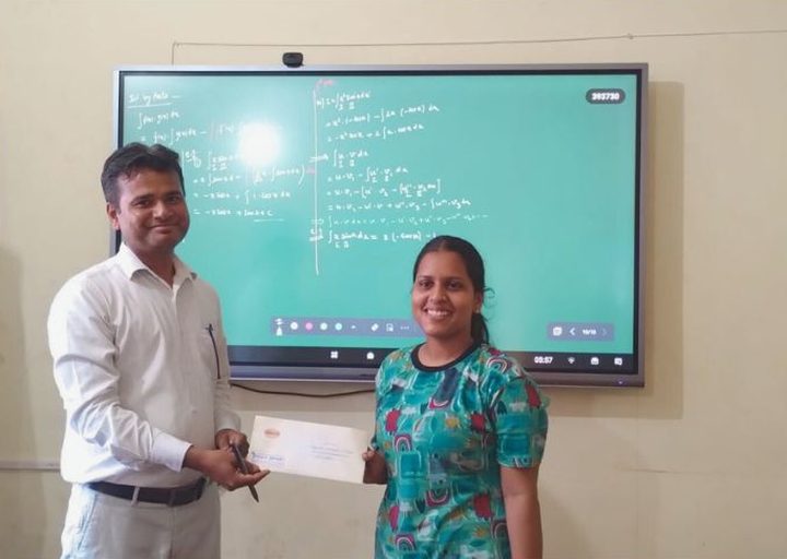 A student receiving a reward from a teacher