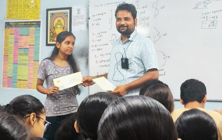 A teacher giving a reward during class