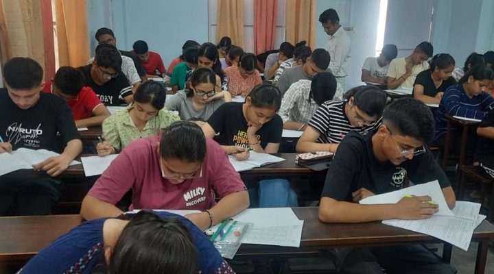 Students writing a test in the classroom